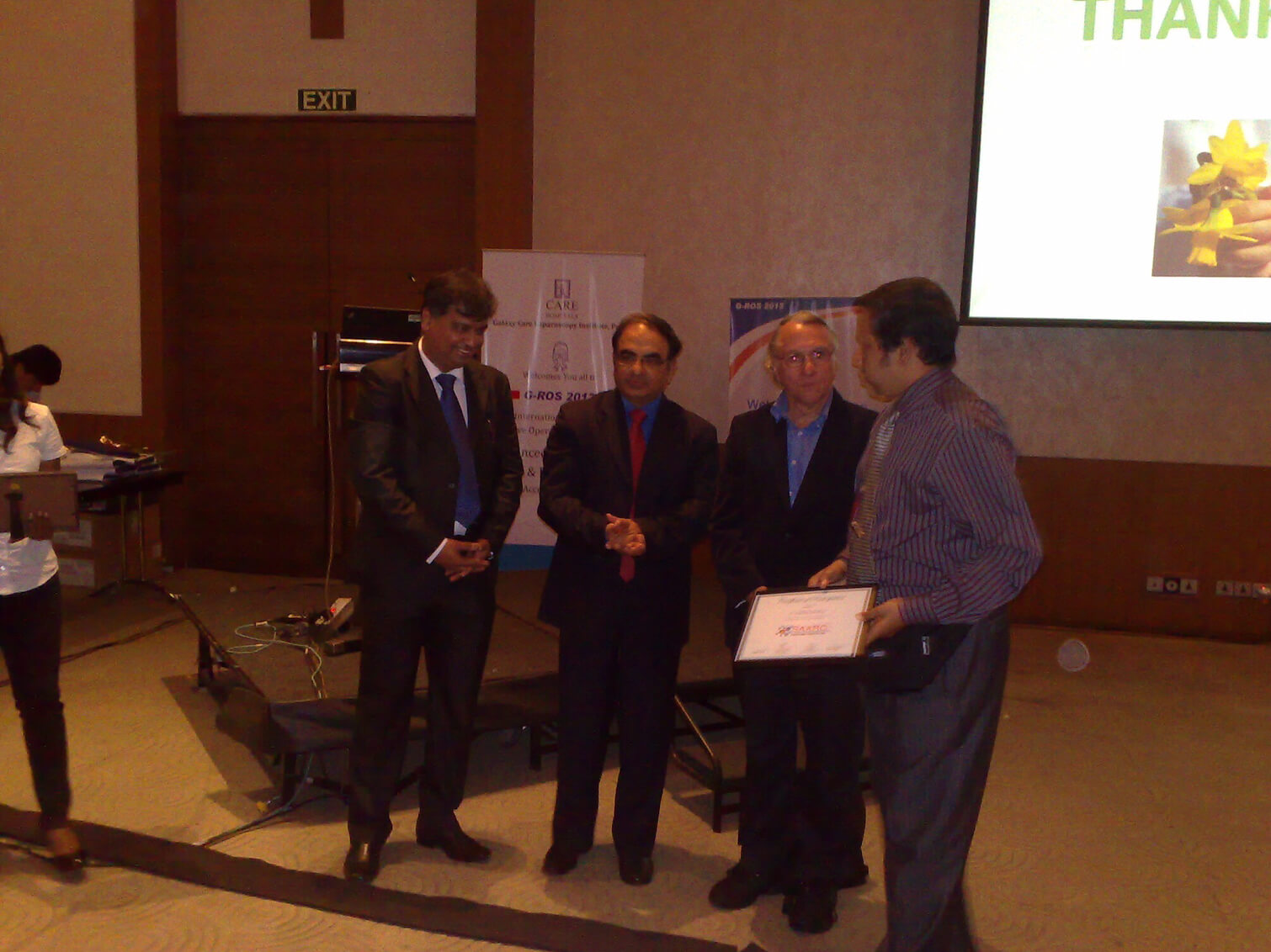 Receiving certificate of attendance in GROS 2012 conference